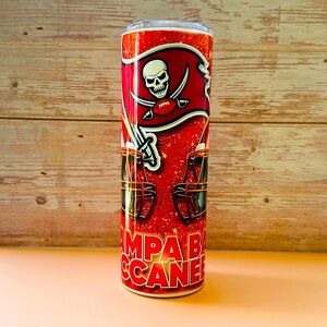 NFL Buccaneers team 
With straw and cleaning stick